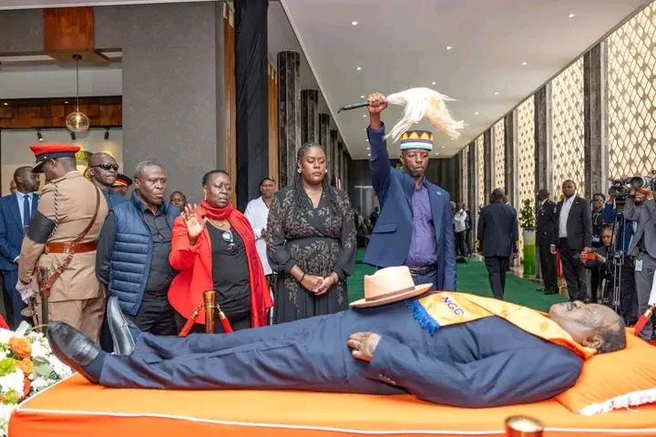 Raila junior paying respect to Raila (father) at parliament