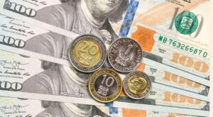 Stacks of Kenya shilling and US dollar banknotes